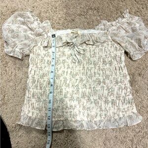 Floral crop ruched off the shoulder